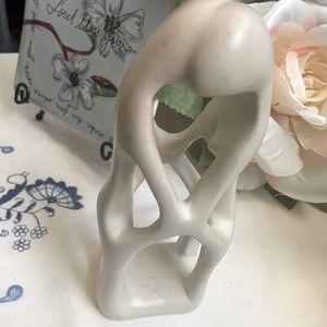 Stone embracing couple